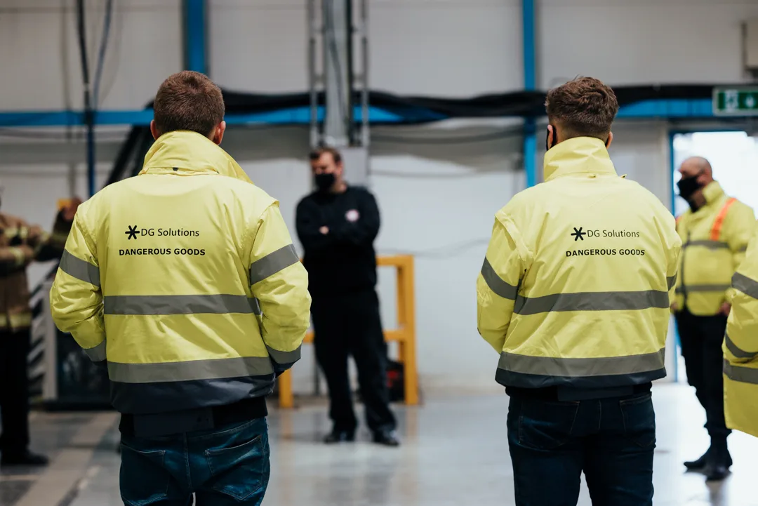 DG Solutions specialists at work in a warehouse